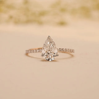 solitaire lab grown diamond engagement ring placed with a beige colored background