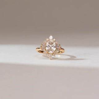 yellow gold lab grown diamond engagement ring placed with an off white background
