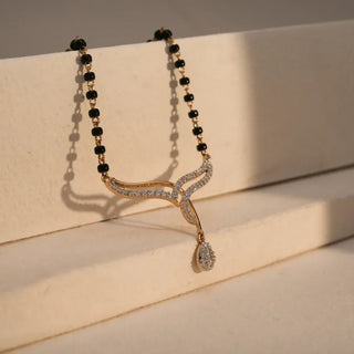 lab grown diamond mangalsutra placed on a beige surface
