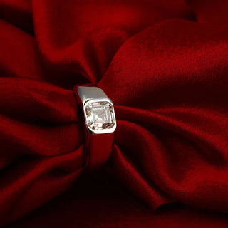 white gold men's lab grown diamond engagement ring placed with a red silk cloth 