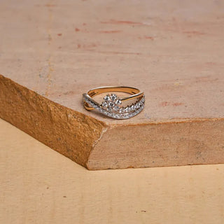 yellow gold lab grown diamond designer ring placed on a wooden surface with a beige background