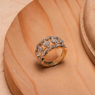 yellow gold lab grown diamond wedding band placed on a wooden surface with a beige background