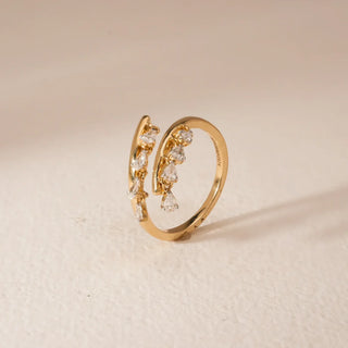 yellow gold lab grown diamond engagement ring placed with a beige background
