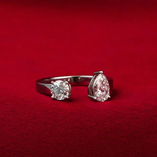 white gold lab grown diamond toi et moi ring placed with a red background