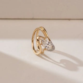 yellow gold stackable lab grown diamond engagement ring placed with a cream colored background