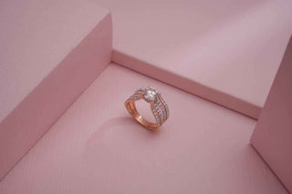 Top view of a lab-grown diamond ring on a pink background, crafted by Réia Diamonds