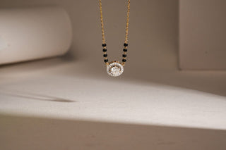lab-grown diamond mangalsutra placed in the center of the frame with a beige background