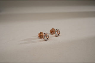 Rose gold stud earrings with a square halo around a central lab-grown diamond cluster, on a clean white surface