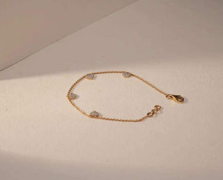 lab-grown diamond bracelet with a light beige and cream background 