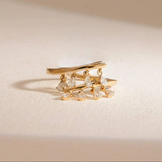 yellow gold lab-grown diamond cocktail ring placed with a light beige background