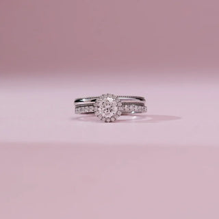 white gold stackable lab grown diamond engagement ring placed with a light pink background