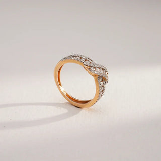 yellow gold lab grown diamond wedding band placed with a white and grey background