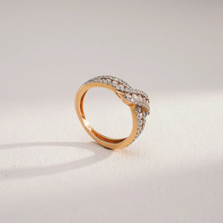 yellow gold lab grown diamond ring placed with a white and grey background