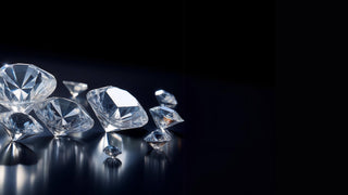 Close-up of sparkling lab-grown diamonds from Réia Diamonds, arranged on a dark surface, showcasing their brilliance and clarity.