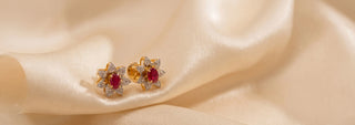 Réia pair of rose gold diamond bangles with lab-grown diamonds on velvet fabric.