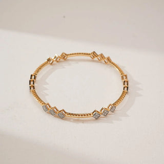 Top view of Geometric Rhombus Trio Diamond Bangle in yellow gold, featuring pavé-set round lab-grown diamonds arranged in repeating rhombus motifs along a structured circular band.