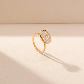 Angled view of Cushion-Cut Solitaire Diamond Ring in 14KT Yellow Gold, featuring a bezel-set lab-grown diamond with rounded edges.