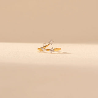 Front view of Floral Vine Diamond Ring in 14KT Yellow Gold, featuring diamond flowers and leaf motifs along the open, flowing band.