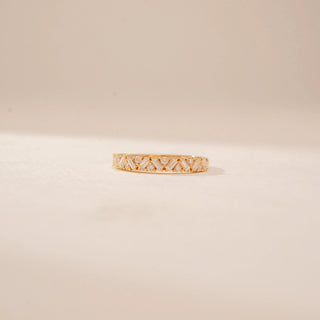 Front view of a 14KT Yellow Gold diamond band with alternating rectangular and round diamonds in a criss-cross pattern.