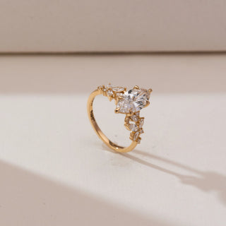 Angled view of Marquise Floral Bloom Diamond Ring in 14KT yellow gold, featuring a vertical marquise centre diamond with marquise and round accent stones forming a floral motif.