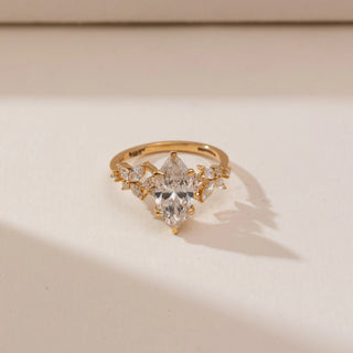 Front view of Marquise Floral Bloom Diamond Ring in 14KT yellow gold, featuring a vertical marquise centre diamond with marquise and round accents in a floral design.