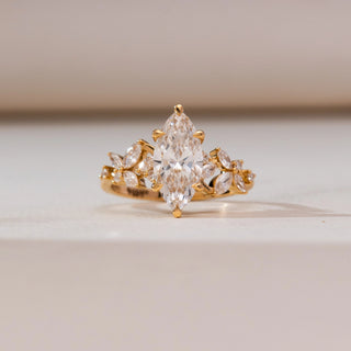 Close-up front view of Marquise Floral Bloom Diamond Ring in 14KT yellow gold, showcasing a vertical marquise centre diamond with floral marquise and round accents.