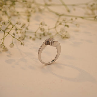 Side view of Reia's Twilight Embrace Diamond Vow Ring in 14KT white gold, featuring a round-cut EF-VVS lab-grown diamond with pave detailing, styled with floral accents.