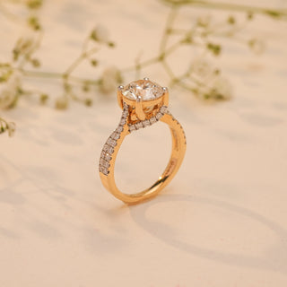 Side view of Reia's Crowned Radiance Diamond Proposal Ring in 14KT yellow gold, featuring an elevated round-cut EF-VVS lab-grown diamond on a pave band with floral accents.