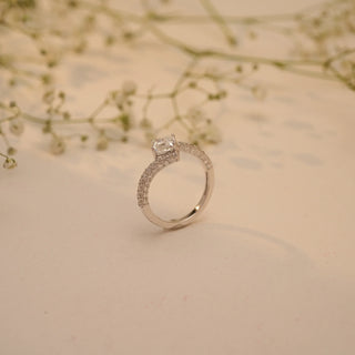 Side view of Reia's Twinned Souls Diamond Vow Ring in 14KT white gold, showcasing a split-shank pave band with an oval-cut EF-VVS lab-grown diamond.