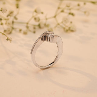 Side view of Reia's Twilight Embrace Diamond Vow Ring in 14KT white gold, featuring a round-cut EF-VVS lab-grown diamond with pave detailing, styled with floral accents.