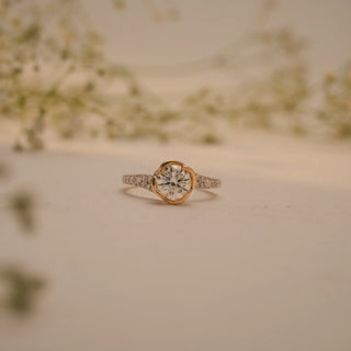 Front view of the Celeste Embrace Solitaire Diamond Ring by Reia, showcasing the luminous round-cut lab-grown diamond embraced by a gold halo.