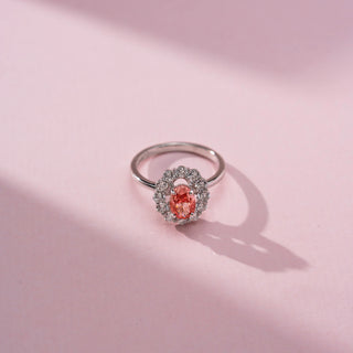 Top view of Majestic Crimson Halo Diamond Ring in 14KT White Gold, featuring an oval red lab-grown diamond with a diamond halo.