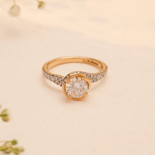 Top view of Reia's Celeste Embrace Solitaire Diamond Ring, crafted in 14KT yellow gold with EF-VVS lab-grown diamonds and pave detailing.