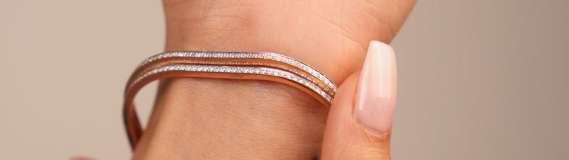 Sleek lab grown diamond bangles in rose gold, designed by Reia with shimmering rows of EF-VVS diamonds, perfect for everyday luxury and timeless elegance.