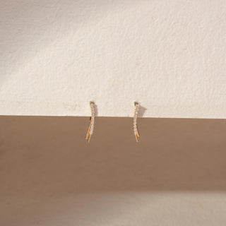 Front view of Linear Diamond Earrings in 14KT Yellow Gold, featuring a row of round lab-grown diamonds on sleek curved lines.