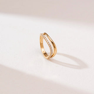 Top view of Wave Bypass Pavé Diamond Ring in 14KT yellow gold, featuring two overlapping curves with one band set in round pavé diamonds for a sleek, modern look.
