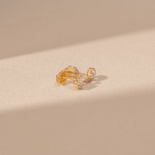 Angled view of Pear Diamond Drop Earrings in 14KT Yellow Gold, featuring pear-cut diamonds with pavé accents.