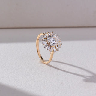 Side view of Sunburst Cluster Diamond Ring in 14KT Yellow Gold, featuring a round lab grown diamond centre with baguette accents radiating outward. Set on a beige backdrop, the design highlights depth and brilliance.
