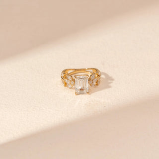 Top  view of Emerald-Cut Diamond Ring in 14KT Yellow Gold, featuring an emerald-cut centre diamond and floral side accents.