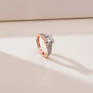 Angled view of Double Row Pavé Diamond Ring in 14KT yellow gold, featuring a round brilliant centre diamond with dual rows of pavé-set diamonds along the band.