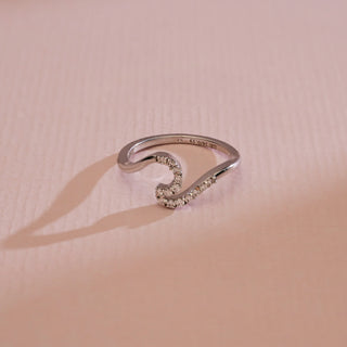 Top view of Curved Elegance Diamond Wave Ring in 14KT White Gold, adorned with EF VVS round diamonds along a fluid wave design that symbolises motion, sparkle, and timeless elegance.
