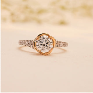 Front view of the Celeste Embrace Solitaire Diamond Ring by Reia, showcasing the luminous round-cut lab-grown diamond embraced by a gold 