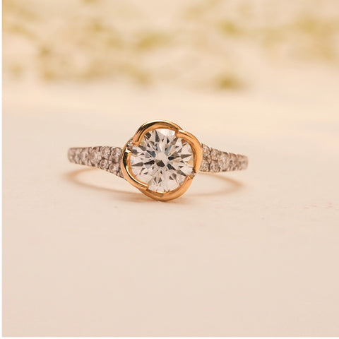 Front view of the Celeste Embrace Solitaire Diamond Ring by Reia, showcasing the luminous round-cut lab-grown diamond embraced by a gold 