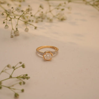 Top view of Reia's Celeste Embrace Solitaire Diamond Ring, crafted in 14KT yellow gold with EF-VVS lab-grown diamonds and pave detailing.