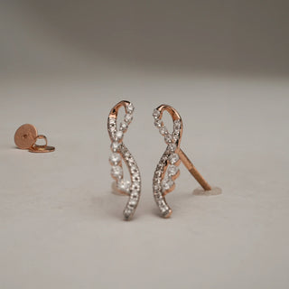 Close-up front view of Cascading Vine Diamond Drop Earrings in 14KT Rose Gold, designed with flowing vine-inspired curves set with round lab-grown diamonds, displayed with Bombay screw backs on a neutral background.