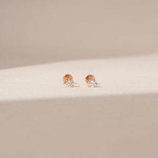 Front view of Round Diamond Stud Earrings in 14KT Yellow Gold, featuring round lab-grown diamonds in a classic prong setting.