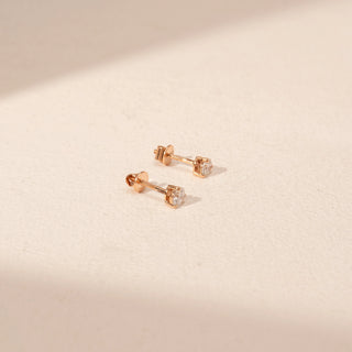 Side view of Round Diamond Stud Earrings in 14KT Yellow Gold, featuring round lab-grown diamonds with screw-back settings.