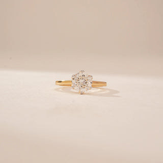 Front view of a 14KT Yellow Gold diamond ring with a round floral-style centre and a sleek plain band.