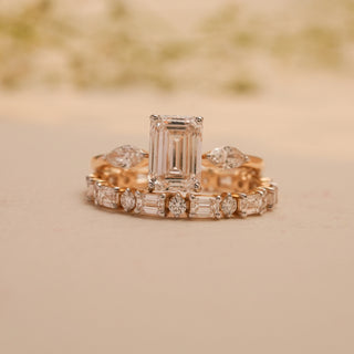 Front view of the Gilded Harmony Emerald Diamond Ring by Reia, showcasing a radiant emerald-cut EF-VVS lab-grown diamond flanked by marquise side stones.