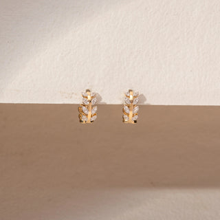  Close up view of Leaf Cluster Diamond Earrings in 14KT Yellow Gold, featuring marquise and round lab-grown diamonds.